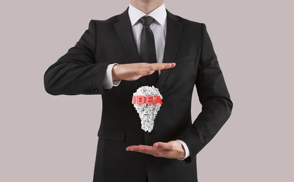 Businessman showing  to idea — Stock Photo, Image