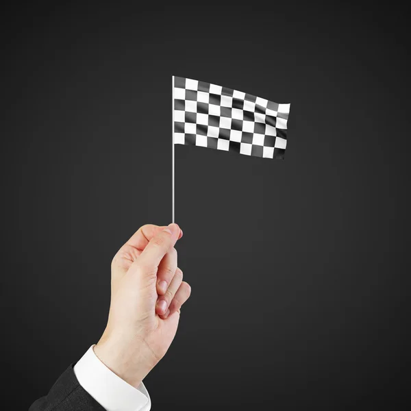 Checkered flag in hand — Stock Photo, Image