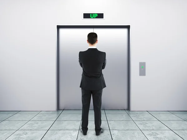 Businessman and elevator — Stock Photo, Image