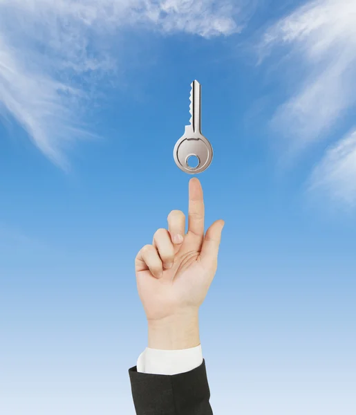 Hand pointing to key — Stock Photo, Image