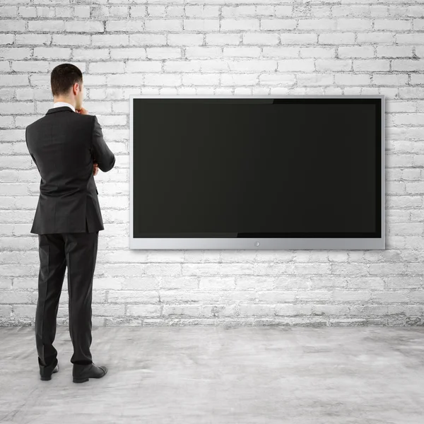 Businessman looking  to TV — Stock Photo, Image