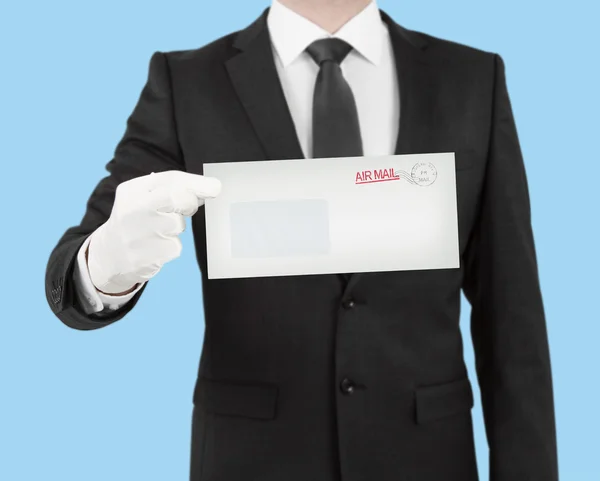 Businessman giving a envelope — Stock Photo, Image