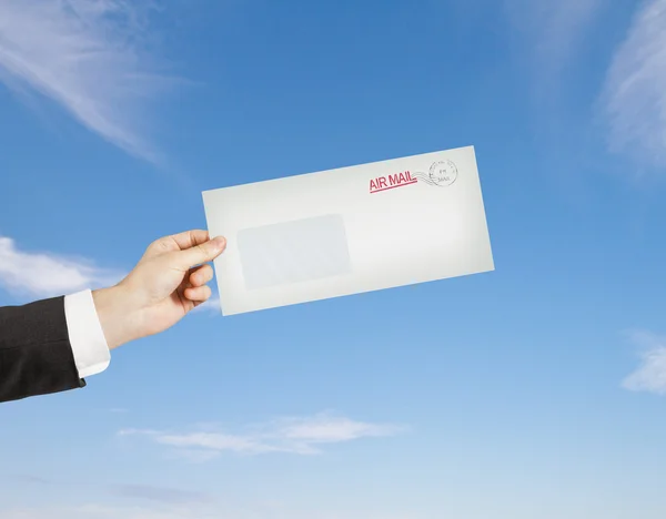 Hand giving a envelope — Stock Photo, Image