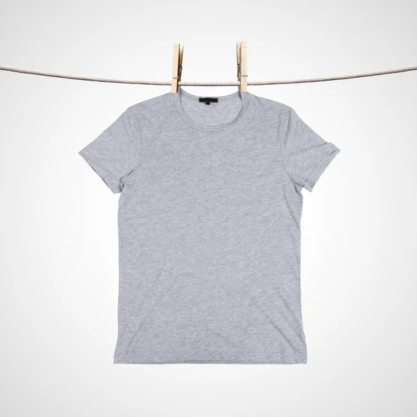 Tshirt on clothesline — Stock Photo, Image