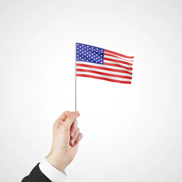 Hand hält Fahne der USA — Stockfoto
