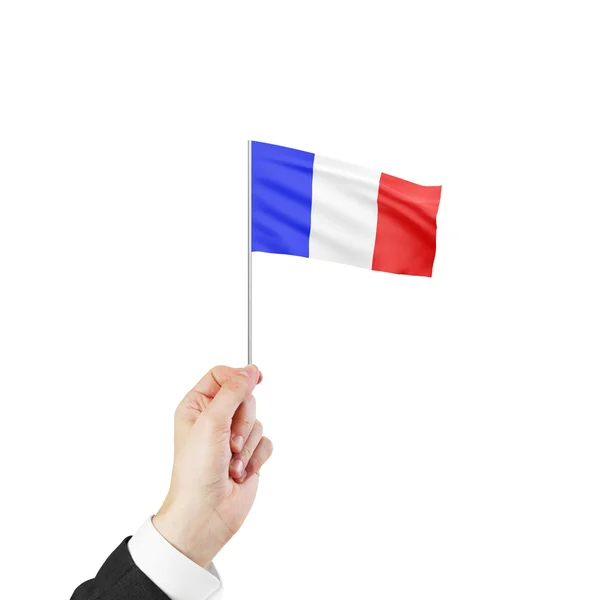 Mão segurando bandeira de França — Fotografia de Stock