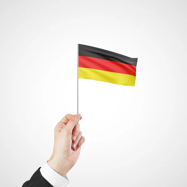 Hand holding flag of  Germany — Stock Photo, Image