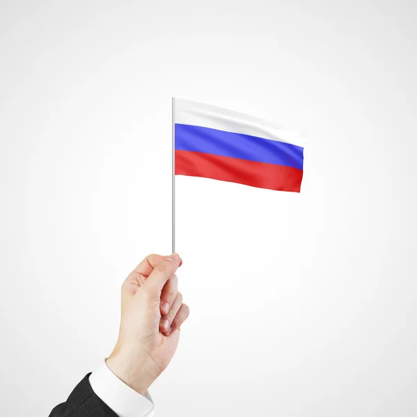 ロシアの旗を持っている手します。 — ストック写真