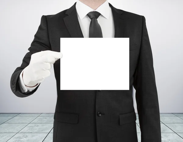 Businessman holding blank poster — Stock Photo, Image