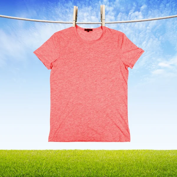 Washing red tshirt — Stock Photo, Image