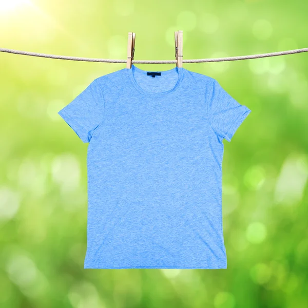 Washing blue tshirt — Stock Photo, Image