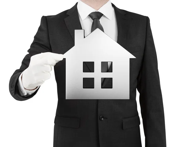 Businessman holding paper house icon — Stock Photo, Image