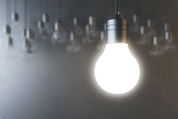 Glödande Glödlampa Suddig Betong Vägg Bakgrund Idé Innovation Lösning Och — Stockfoto