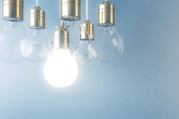 Glowing light bulb on blurry blue wall background. Idea, innovation, solution and invention concept. Mock up, 3D Rendering