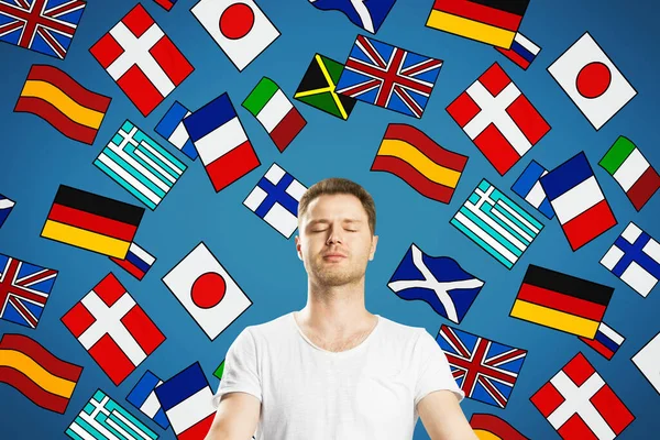 Портрет Привлекательного Молодого Европейского Медитирующего Человека Абстрактными Красочными Рисунками Флагов — стоковое фото