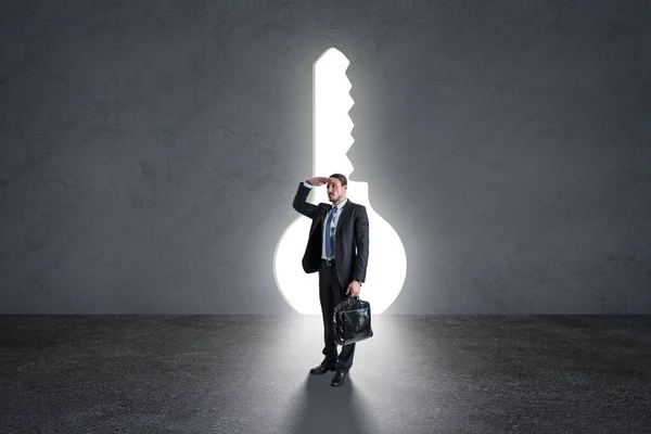 Businessman Standing Concrete Interior Abstract Bright Keyhole Opening Success Future — Stock Photo, Image