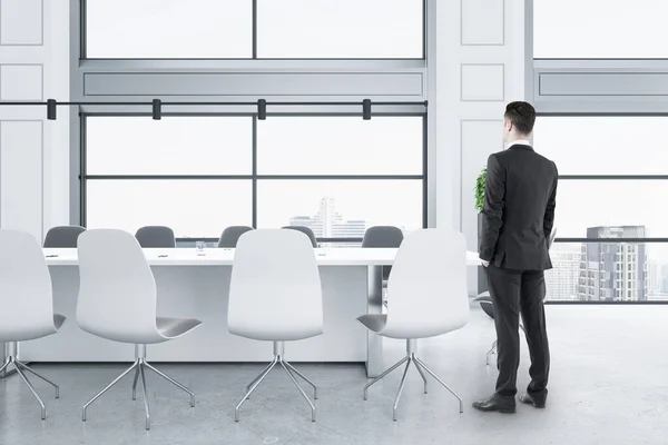 Businessman Standing Modern White Concrete Meeting Room Interior Panoramic City — 스톡 사진
