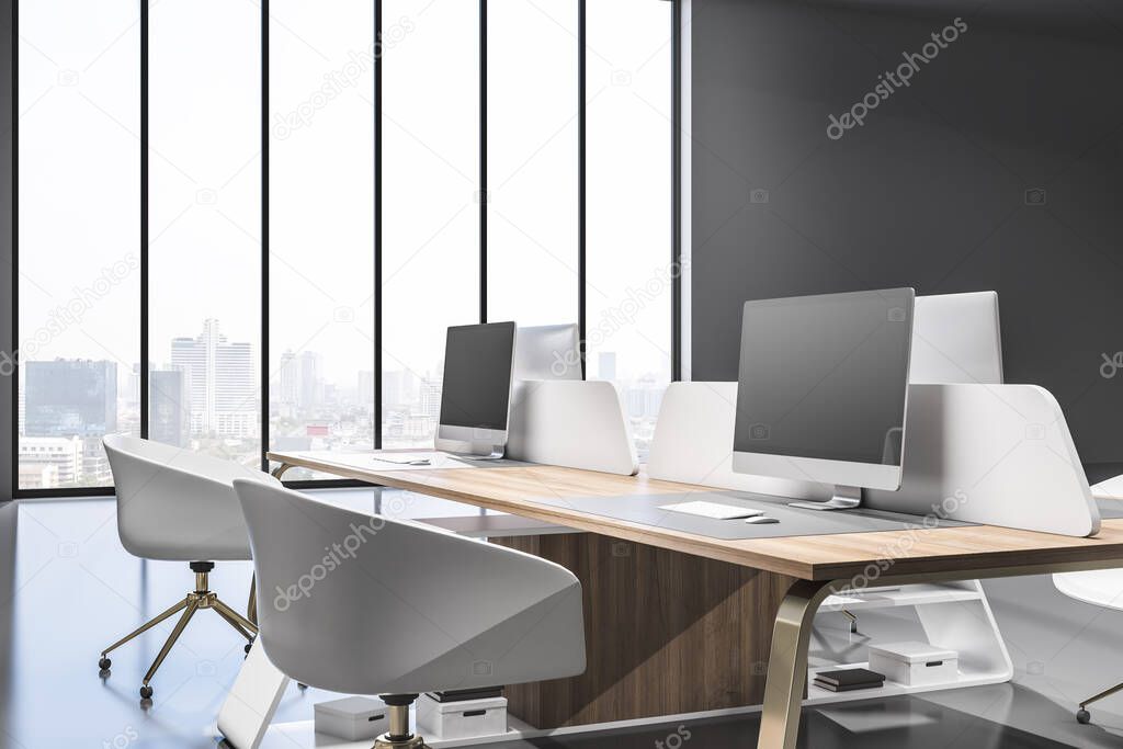 Contemporary coworking office interior with wooden furniture, equipment, computer monitors and window with blurry city view and daylight. 3D Rendering