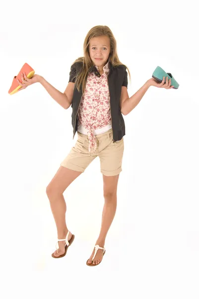 Confused girl with two different shoes — Stock Photo, Image