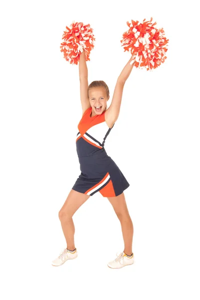 Jong meisje oranje cheerleading pompoms — Stockfoto