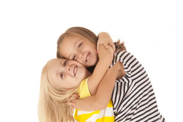 Two young girls giving each other a hug — Stock Photo, Image