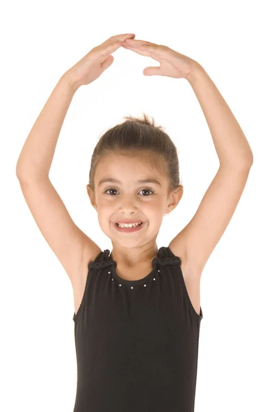 Cute young ballerina girl posing with arms in the air — Stock Photo, Image