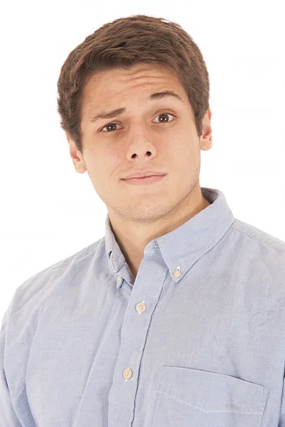 Perplexed looking young man in blue dress shirt — Stock Photo, Image