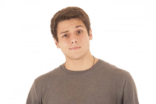 Handsome young man in gray tee shirt with fun face eyebrow raise — Stock Photo, Image