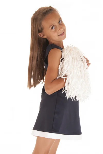Aranyos fiatal barna lány pompom ruhát keres oldalra — Stock Fotó