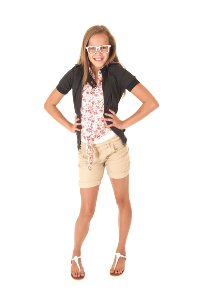 Young female model in shorts holding her hands on her hips — Stock Photo, Image