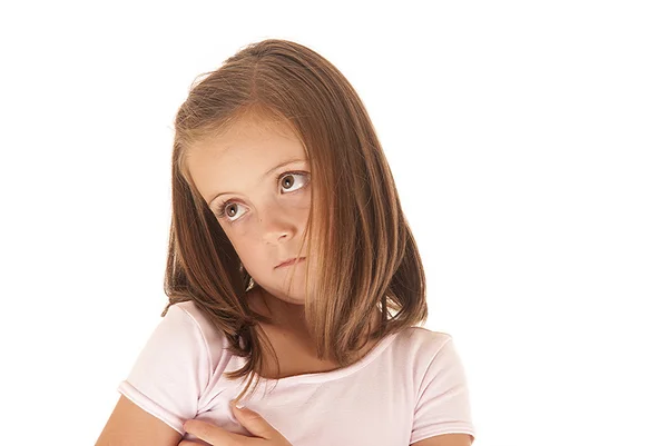 Menina bonito em rosa com um olhar inocente — Fotografia de Stock