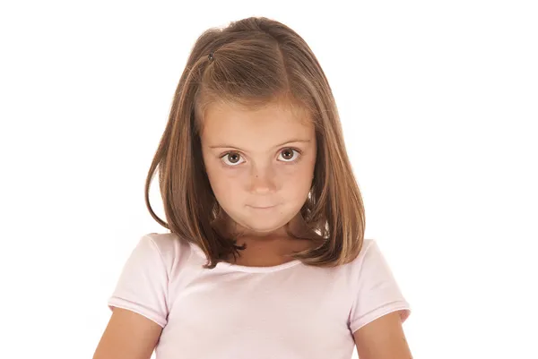 Young girl with big eyes looking at camera with an innocent look — Stock Photo, Image