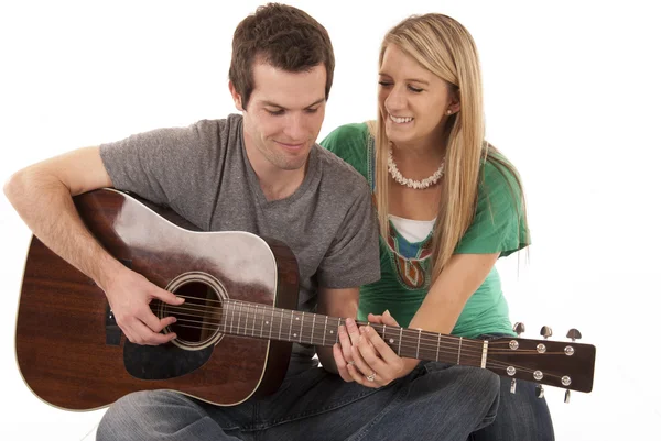 Young couple holding hands playing guitar — Stock Photo, Image