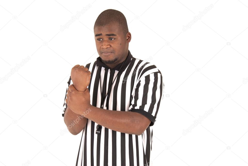 black referee making a sign for a holding call