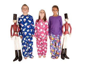 three chldren standing at attention with tin soldiers clipart