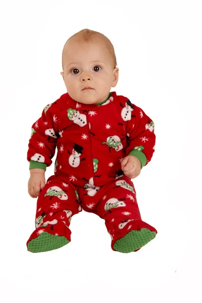 Toddler boy sitting in red snowman pajamas — Stock Photo, Image