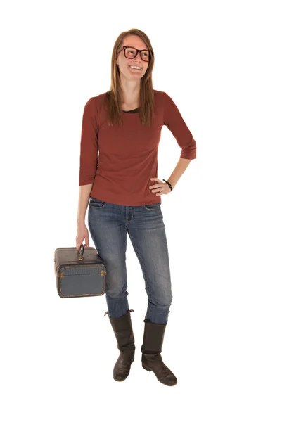 Young woman in casual dress holding old makeup bag — Stock Photo, Image