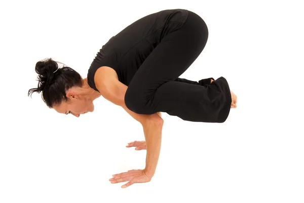 Attractive fit woman wearing a black outfit balancing — Stock Photo, Image