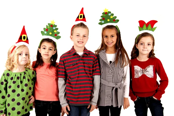 Cute kids in funny holiday hats Royalty Free Stock Photos