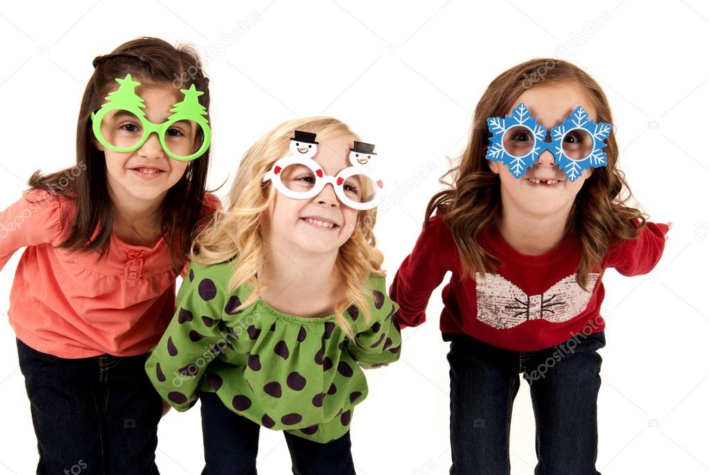 silly girls wearing fun christmas glasses