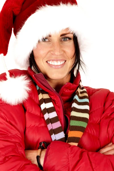 Attractive female model wearing a santa hat arms folded — Stock Photo, Image