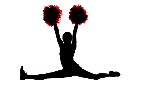 Young girl cheerleader silhouette doing the splits with hands in — Stock Photo, Image