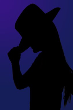 mavi bir backgrou ile ona şapka devrilme cowgirl siluet portre