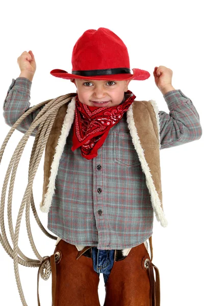 Cute young cowboy flexing muscles holding a rope — Stock Photo, Image