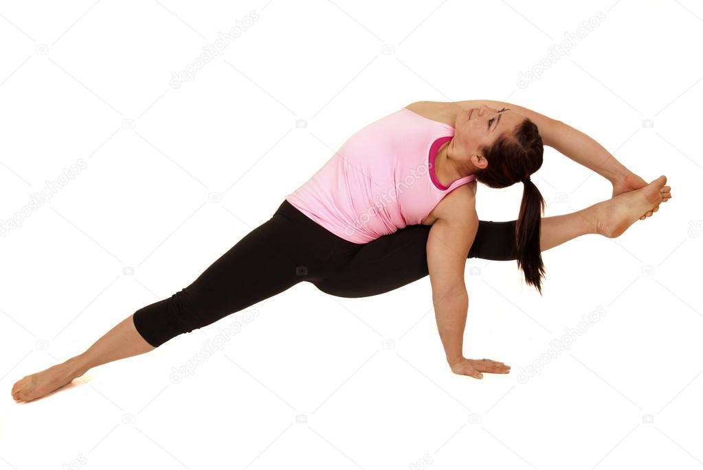 Advanced female model yoga instructor in Visvamitrasana monkey s