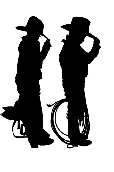 Silhouette of two young cowboys holding a rope and saddle — Stock Photo, Image