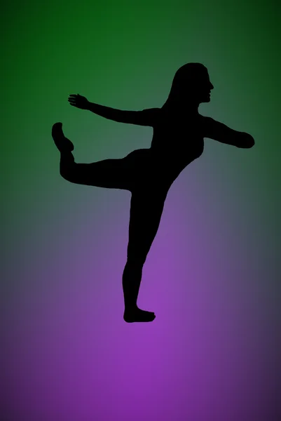 Silhouette of a woman dancing with a green and purple background — Stock Photo, Image