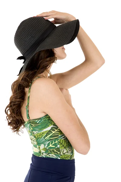 Sideview of a female model in a sunhat and swimsuit — Stock Photo, Image