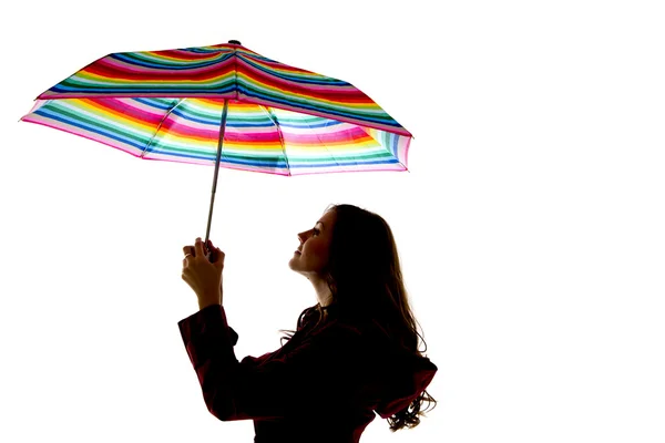 Modelo sosteniendo colorido paraguas de arco iris con fondo blanco —  Fotos de Stock