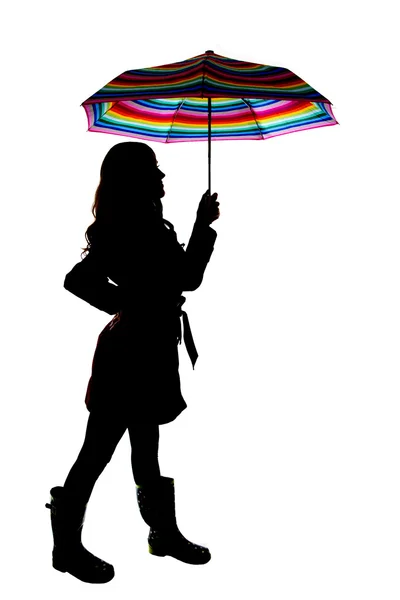 Silhouette with a white background of woman holding colorful umb — Stock Photo, Image